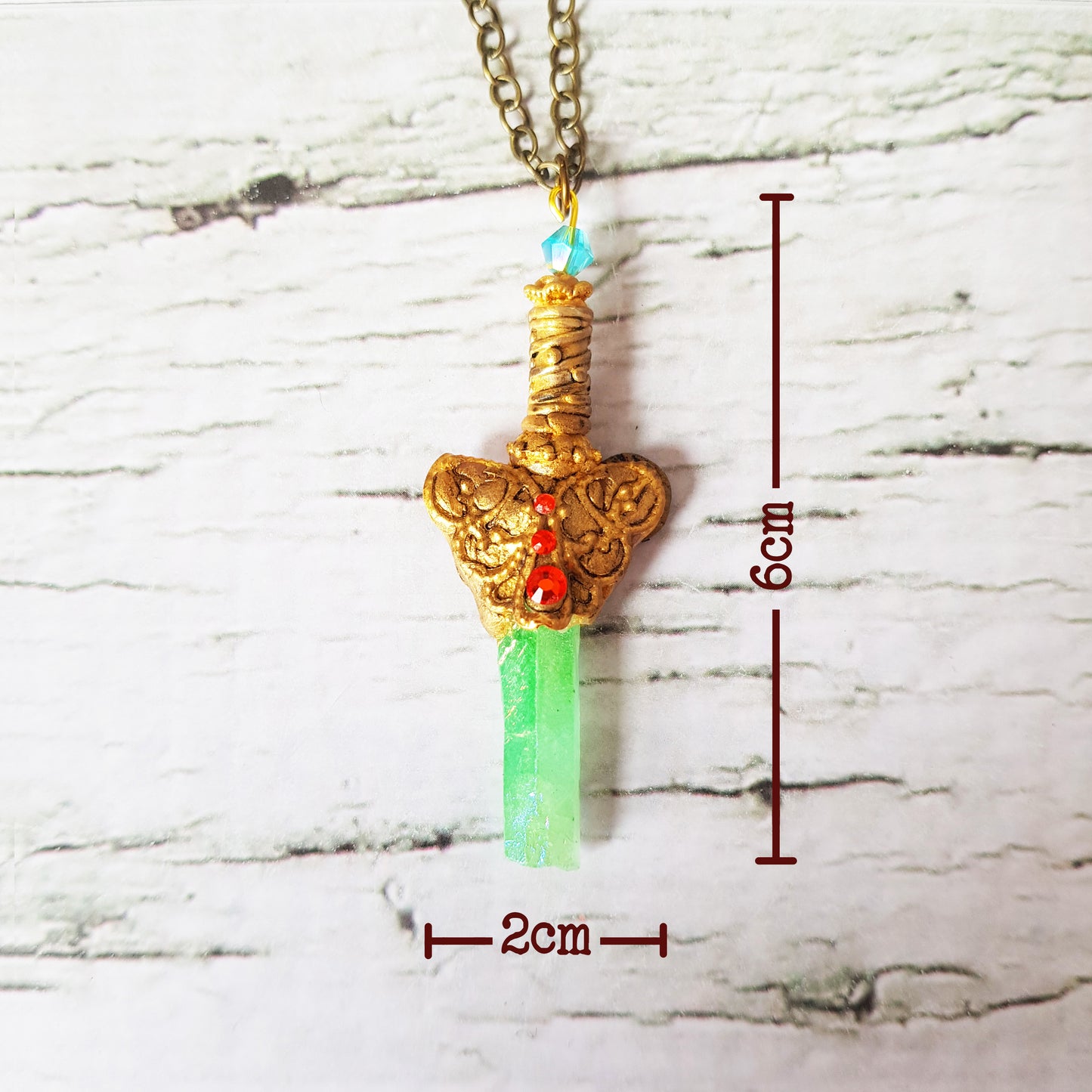 Pendentif: Épée de cristaux